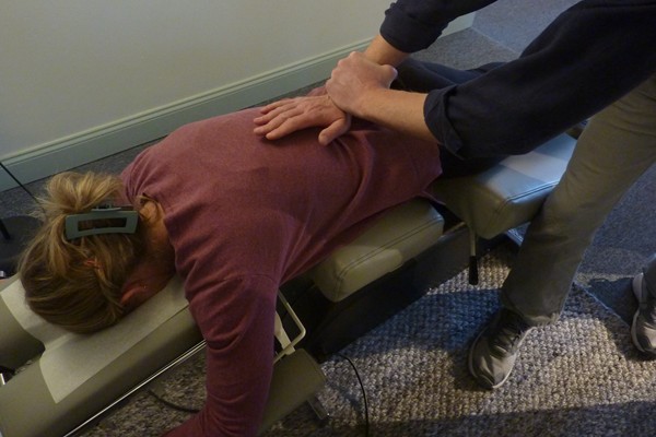 Bozeman chiropractor giving lower back pain treatment to a patient